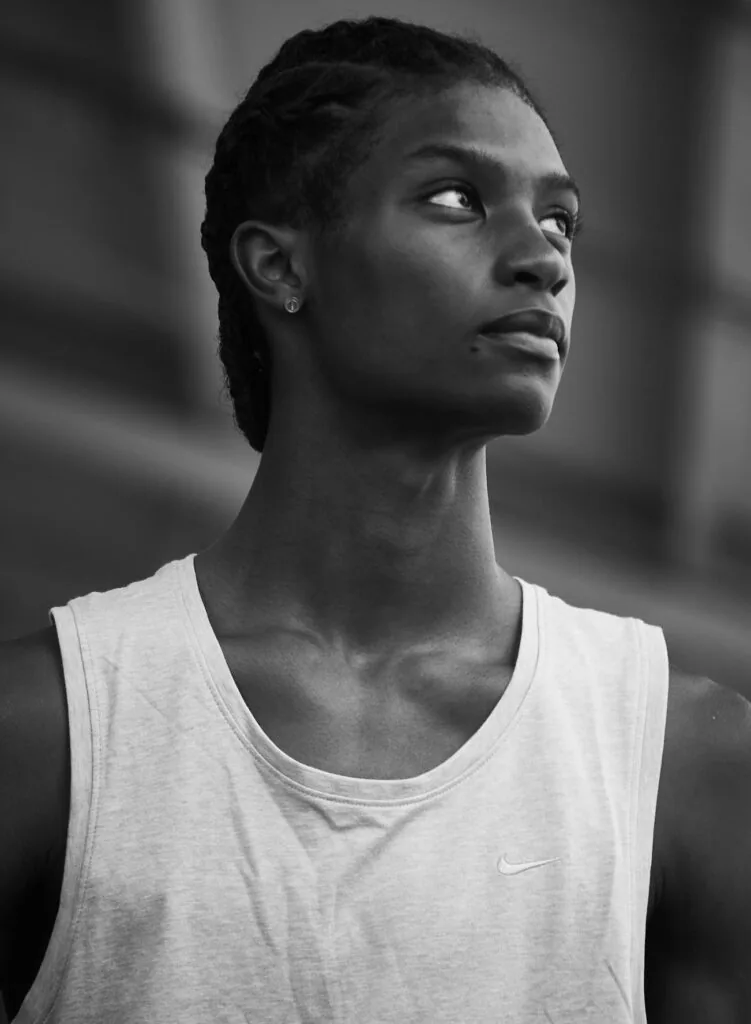 Male model in white sleeveless tank top, profile view, black and white portrait photography